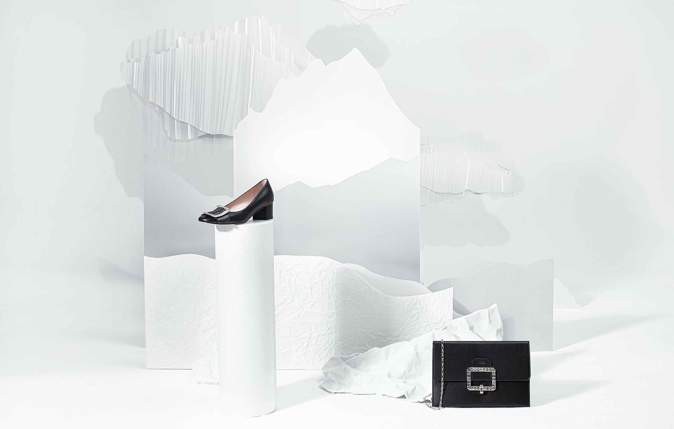 Product staged within a folded paper composition